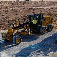 Using three points of contact to enter a Cat motorgrader