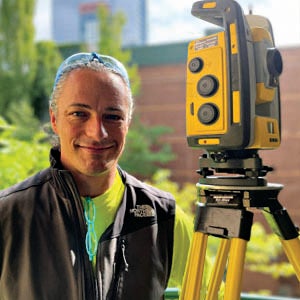 Man with robotic total station